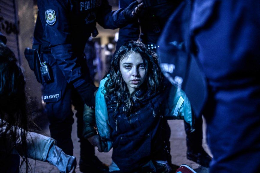 A young girl is pictured after she was wounded during clashes between riot-police and prostestors after the funeral of Berkin Elvan, the 15-year-old boy who died from injuries suffered during last year's anti-government protests, in Istanbul on March 12, 2014. Riot police fired tear gas and water cannon at protestors in the capital Ankara, while in Istbanbul, crowds shouting anti-government slogans lit a huge fire as they made their way to a cemetery for the burial of Berkin Elvan. AFP PHOTO/BULENT KILIC