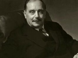 Herbert George Wells siedzący na fotelu