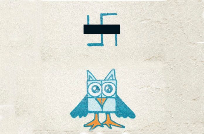 Zamalowany symbol nazistowski na sowę