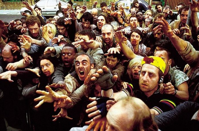 Tłum zombie wyciągających ręce